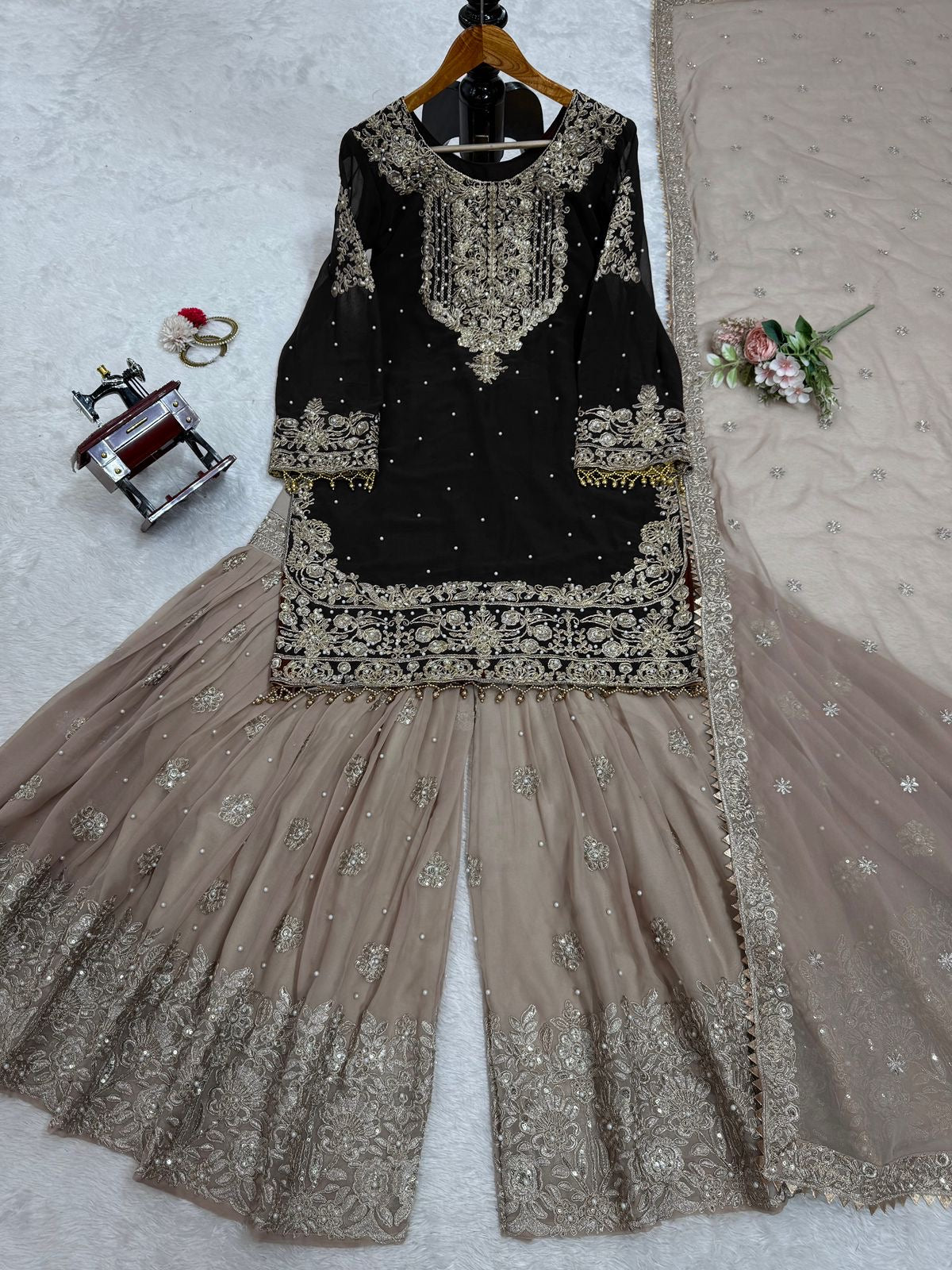 A HEAVY GEORGETTE EMBROIDERED TOP, SHARARA, AND DUPATTA SET