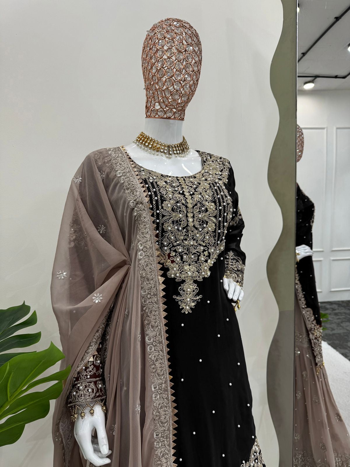 A HEAVY GEORGETTE EMBROIDERED TOP, SHARARA, AND DUPATTA SET