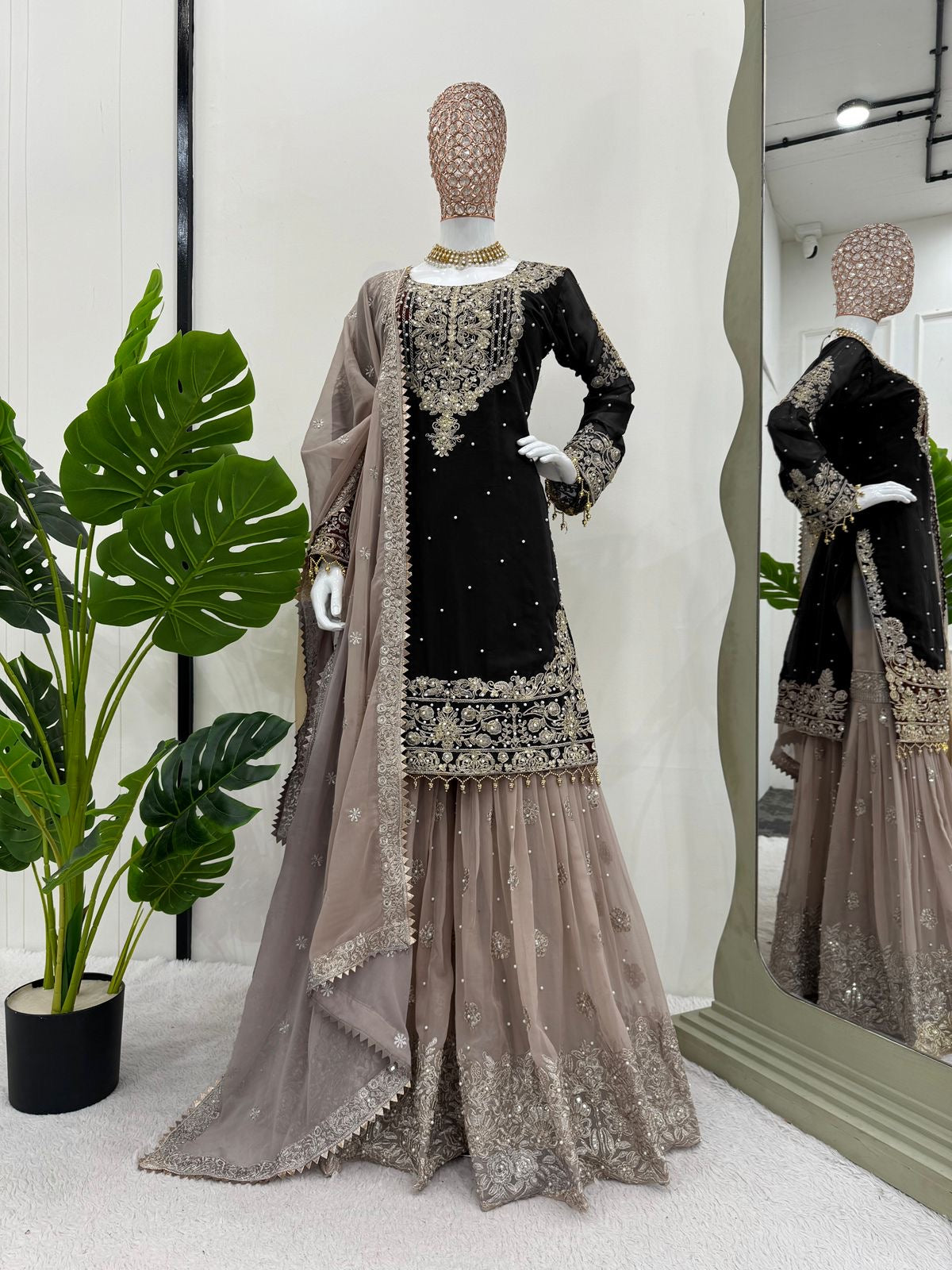 A HEAVY GEORGETTE EMBROIDERED TOP, SHARARA, AND DUPATTA SET