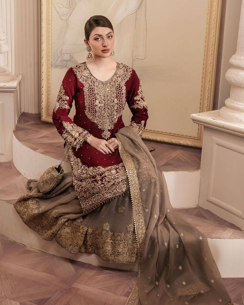 A HEAVY GEORGETTE EMBROIDERED TOP, SHARARA, AND DUPATTA SET