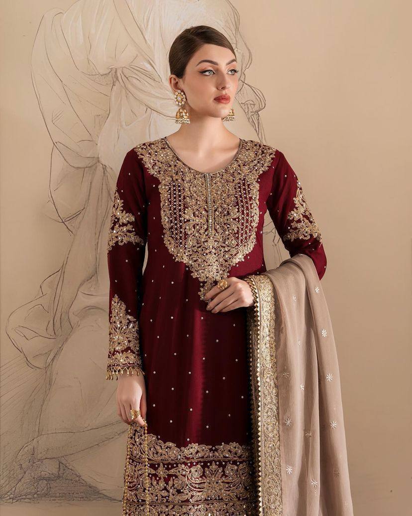 A HEAVY GEORGETTE EMBROIDERED TOP, SHARARA, AND DUPATTA SET