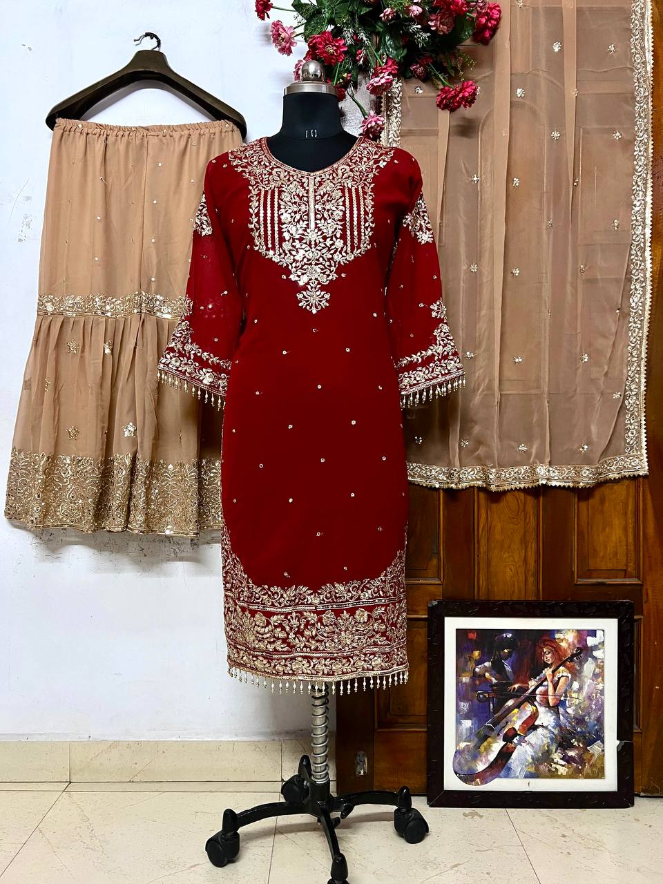 A HEAVY GEORGETTE EMBROIDERED TOP, SHARARA, AND DUPATTA SET